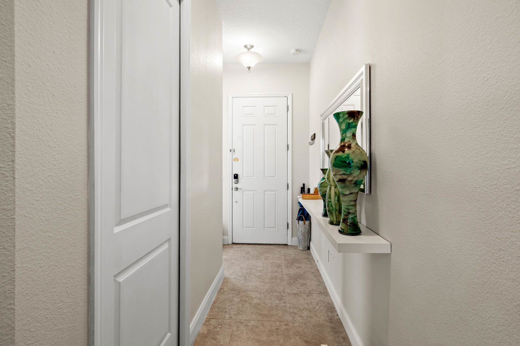 inside front door with long skinny hallway
